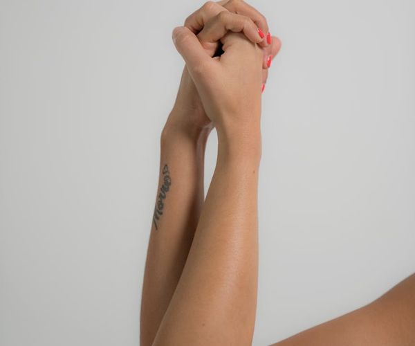 Intertwined hands symbolizing support, community, and connection.