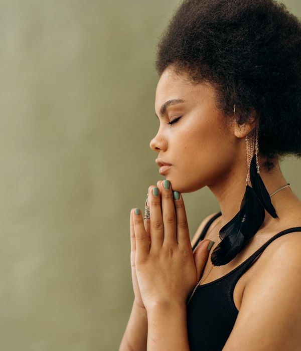 Woman in a calm yoga pose symbolizing inner peace and balance.